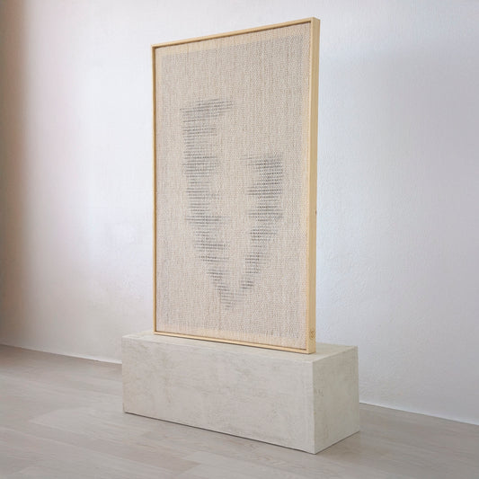 Side view of Huek showing its handwoven wool depth