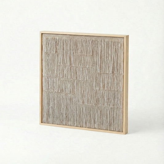 Estheté handwoven wool tapestry shown hanging on a wall