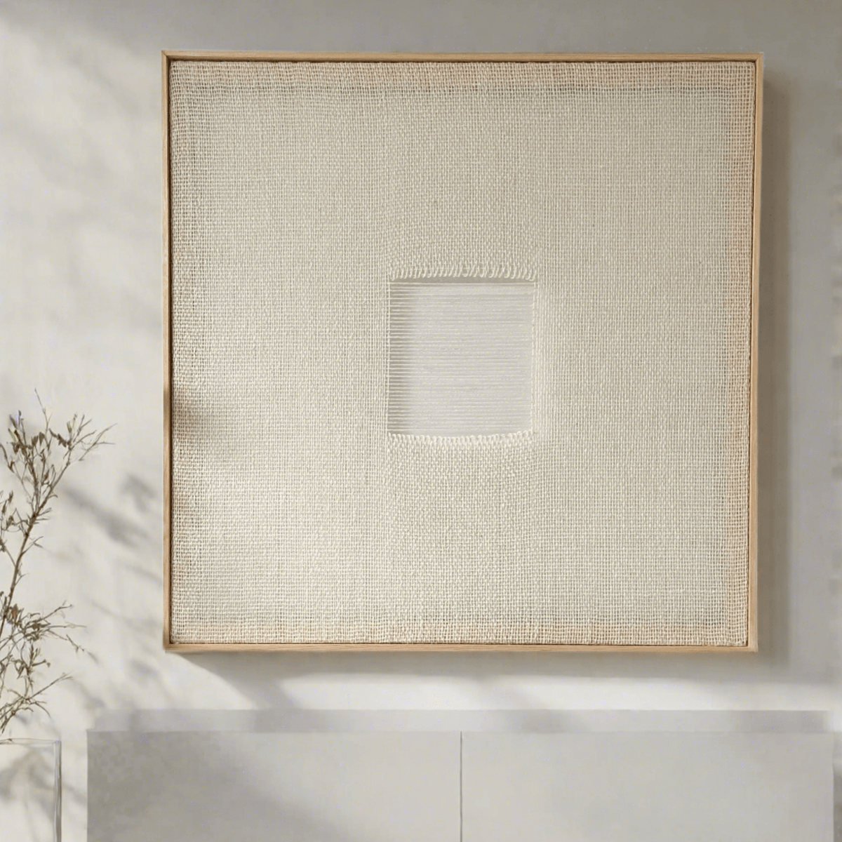 Diskuer handwoven wool tapestry shown hanging on a wall
