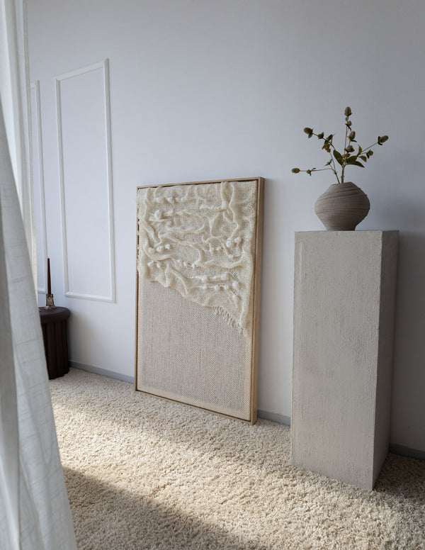 Aura oak/pine wood-framed wool wall hanging in a styled interior