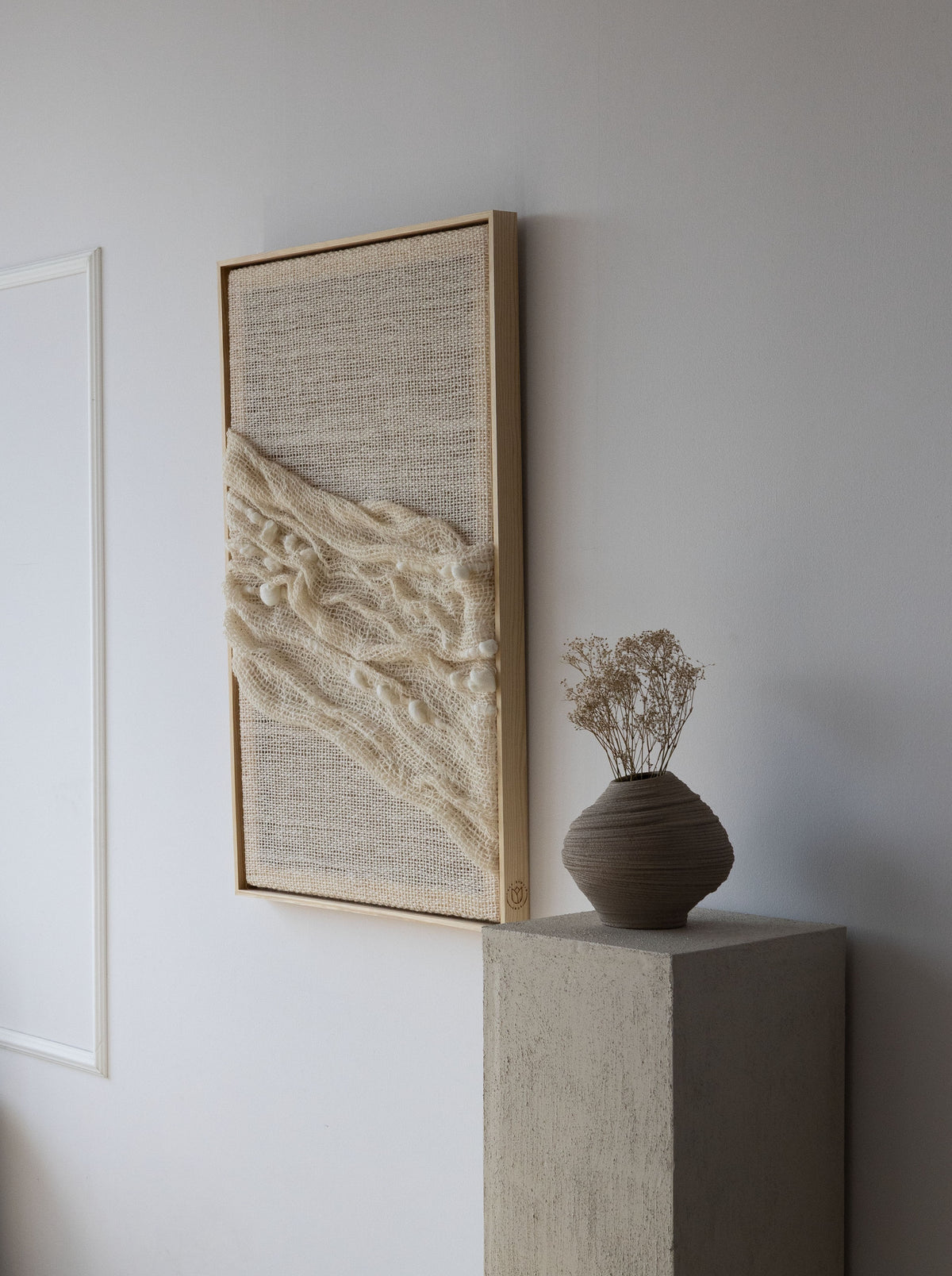 Chal handwoven wool tapestry shown hanging on a wall