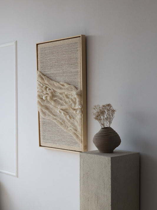 Chal handwoven wool tapestry shown hanging on a wall