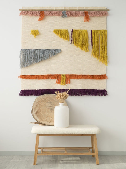 Gelo handwoven wool tapestry shown hanging on a wall