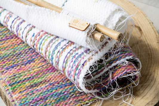 Rainbow wall hanging styled in a bright living room