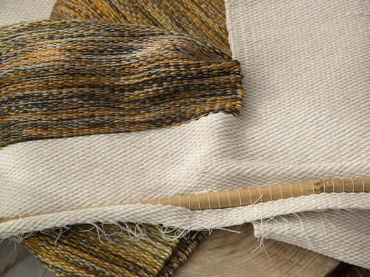 Kauwela handwoven cotton tapestry shown hanging on a wall