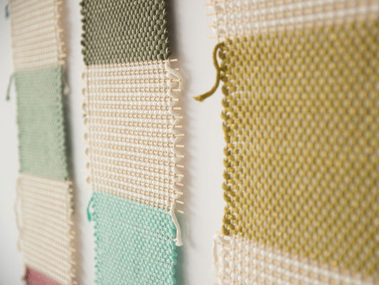 Bieno handwoven cotton tapestry shown hanging on a wall
