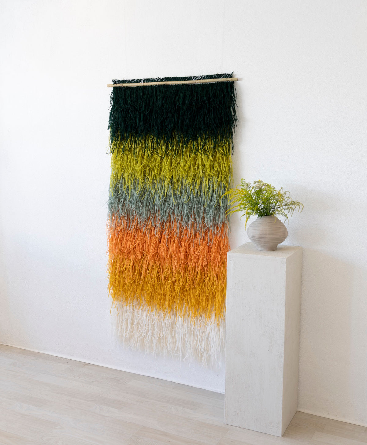 Calaia rod-mounted handwoven wool wall art by Lale Studio & Shop