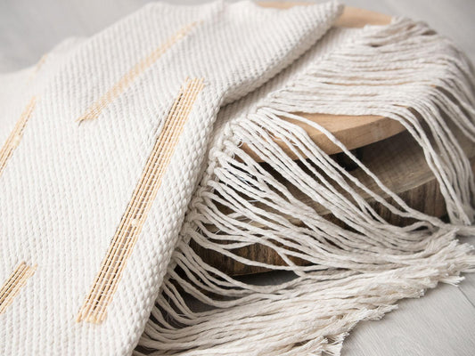 Bambu viivoja handwoven cotton tapestry shown hanging on a wall