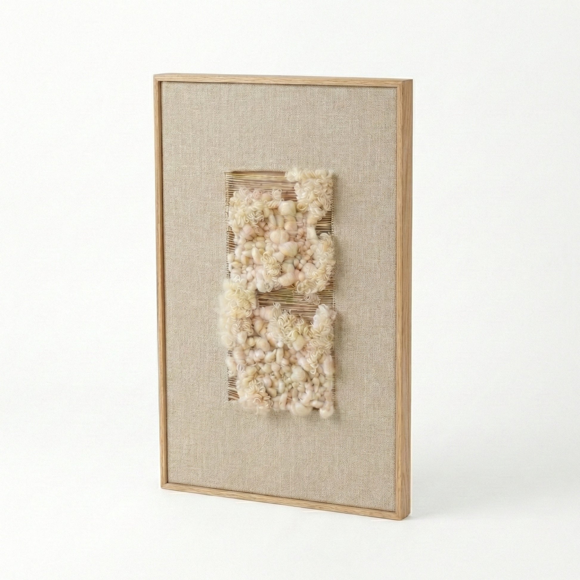 Framed textured wall art on a white background