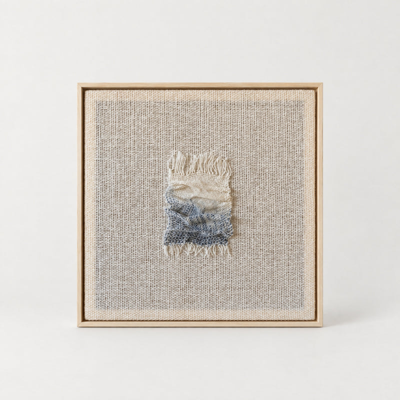 Aestus handwoven wool sculpture with a cream and slate blue folded relief on an open woven wool base in a slim natural pine frame, Lale Studio & Shop