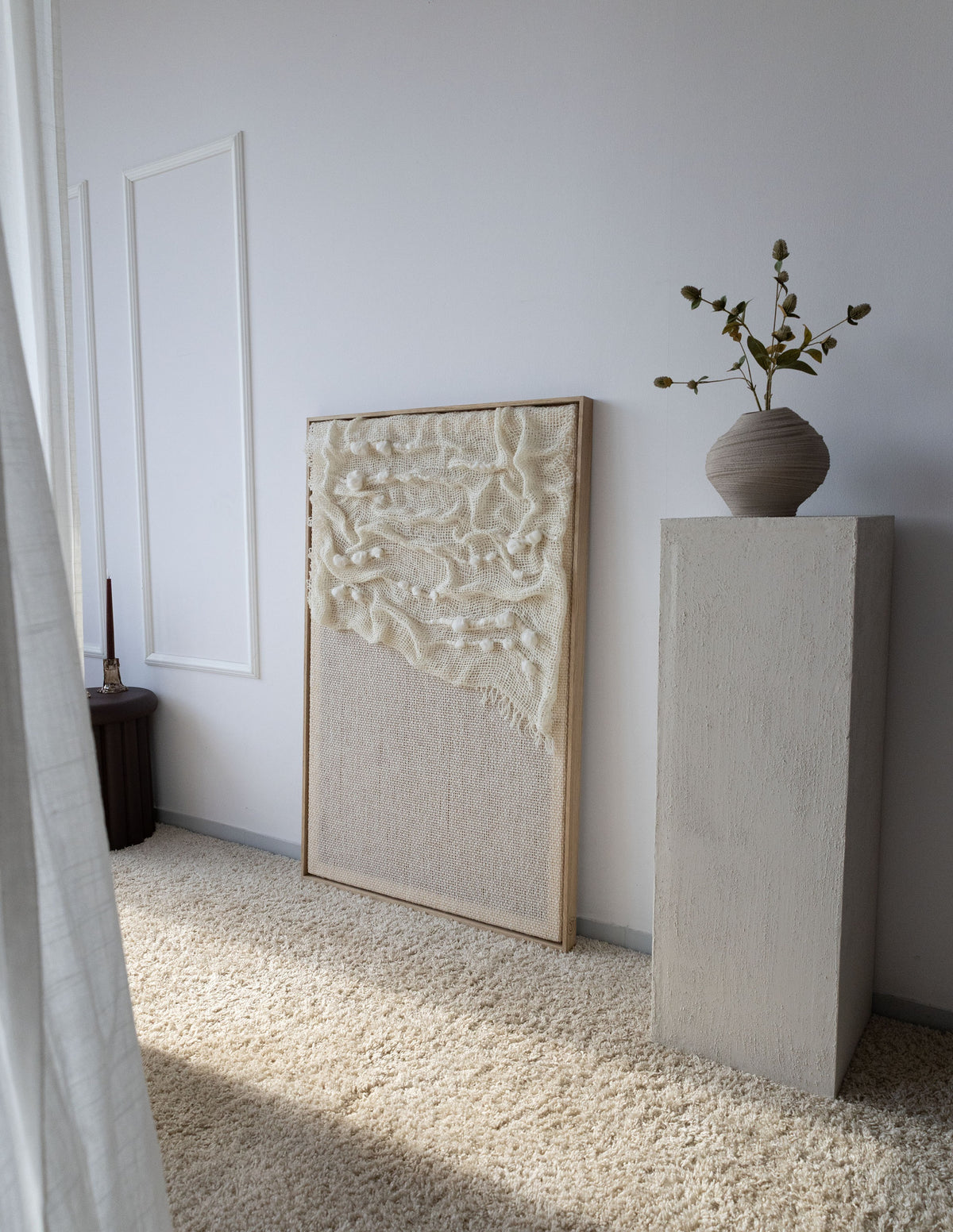 Aura oak/pine wood-framed wool wall hanging in a styled interior