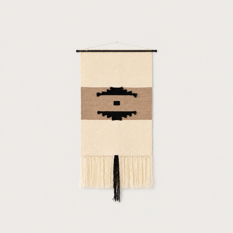Auroa handwoven wool wall hanging with geometric pattern in black, brown and raw white, packshot, Lale Studio & Shop