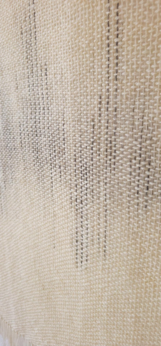 Misty Music handwoven wool tapestry shown hanging on a wall