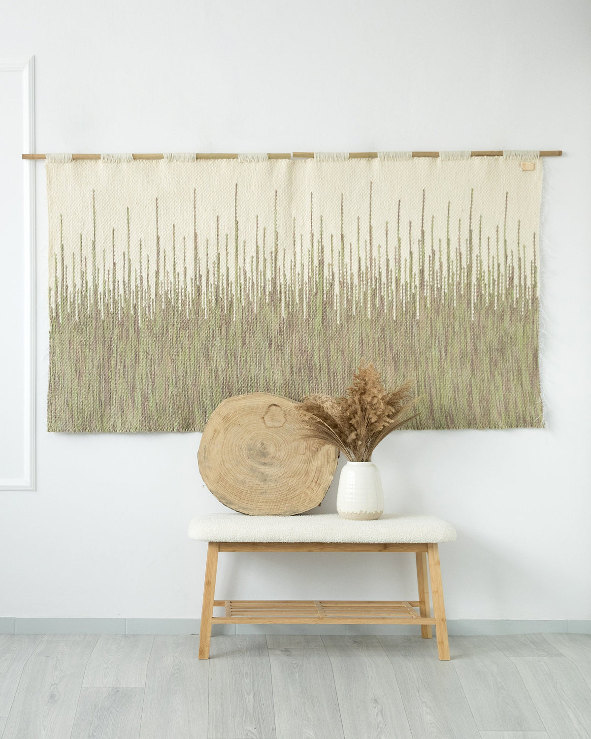 Detail of Brzoza's cream and sage green wool weave with fringe
