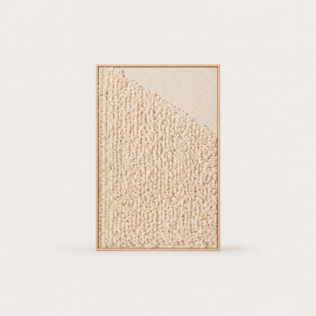 Framed 5 handwoven wool tapestry in natural cream and beige with a subtle looped texture in a slim pine frame, framed textile wall art by Lale Studio & Shop