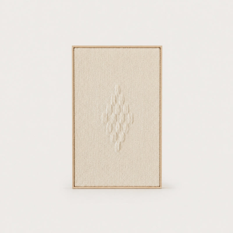 Framed 7 handwoven wool tapestry in soft natural cream with a raised diamond motif in a slim pine frame, framed textile wall art by Lale Studio & Shop