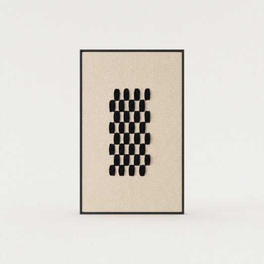 Framed II Black Pattern handwoven two-ply wool tapestry with a deep black geometric grid on a cream ground in a slim pine frame, framed textile wall art by Lale Studio & Shop