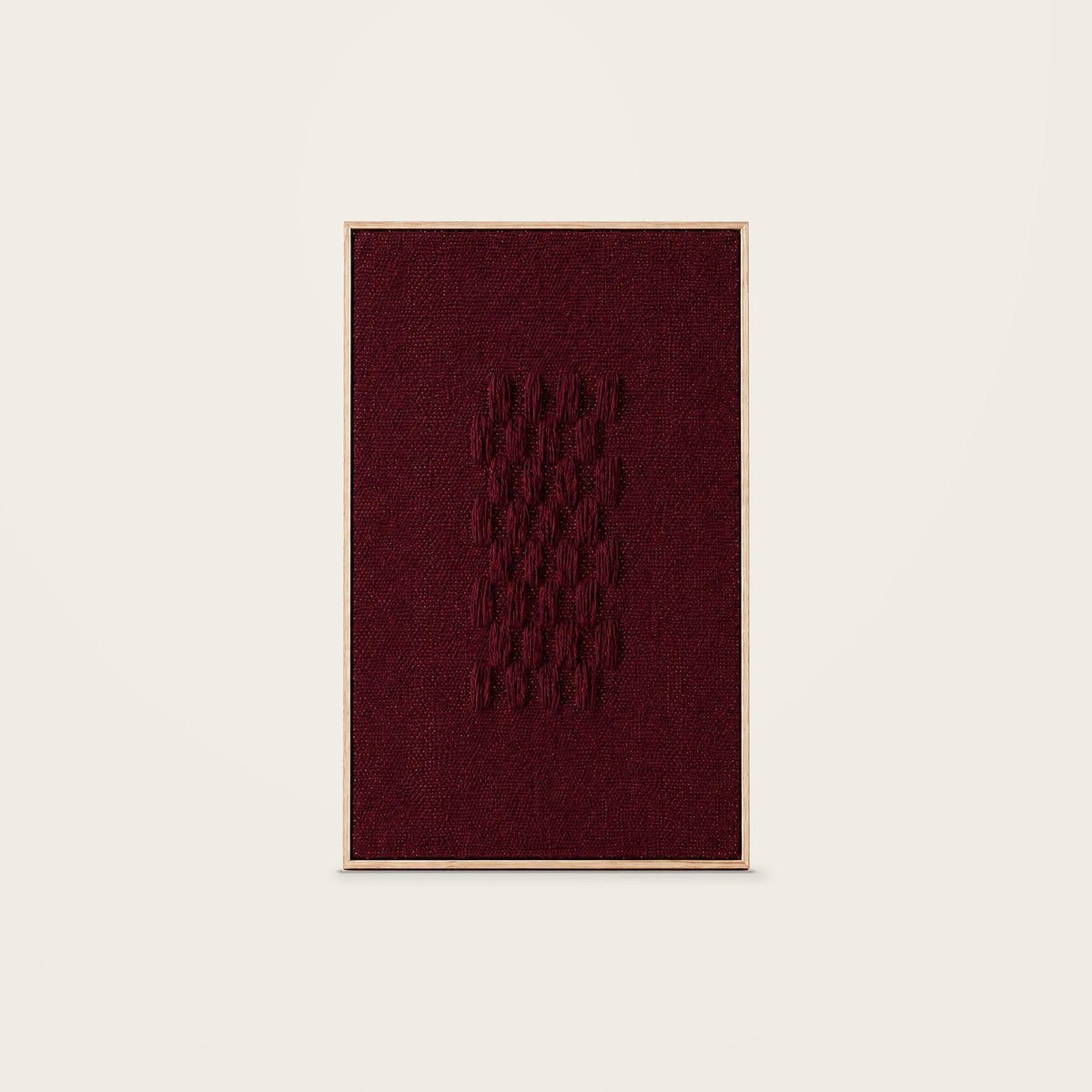 Framed II Wine — burgundy handwoven wool tapestry with raised wool details in a natural wooden frame, front view.