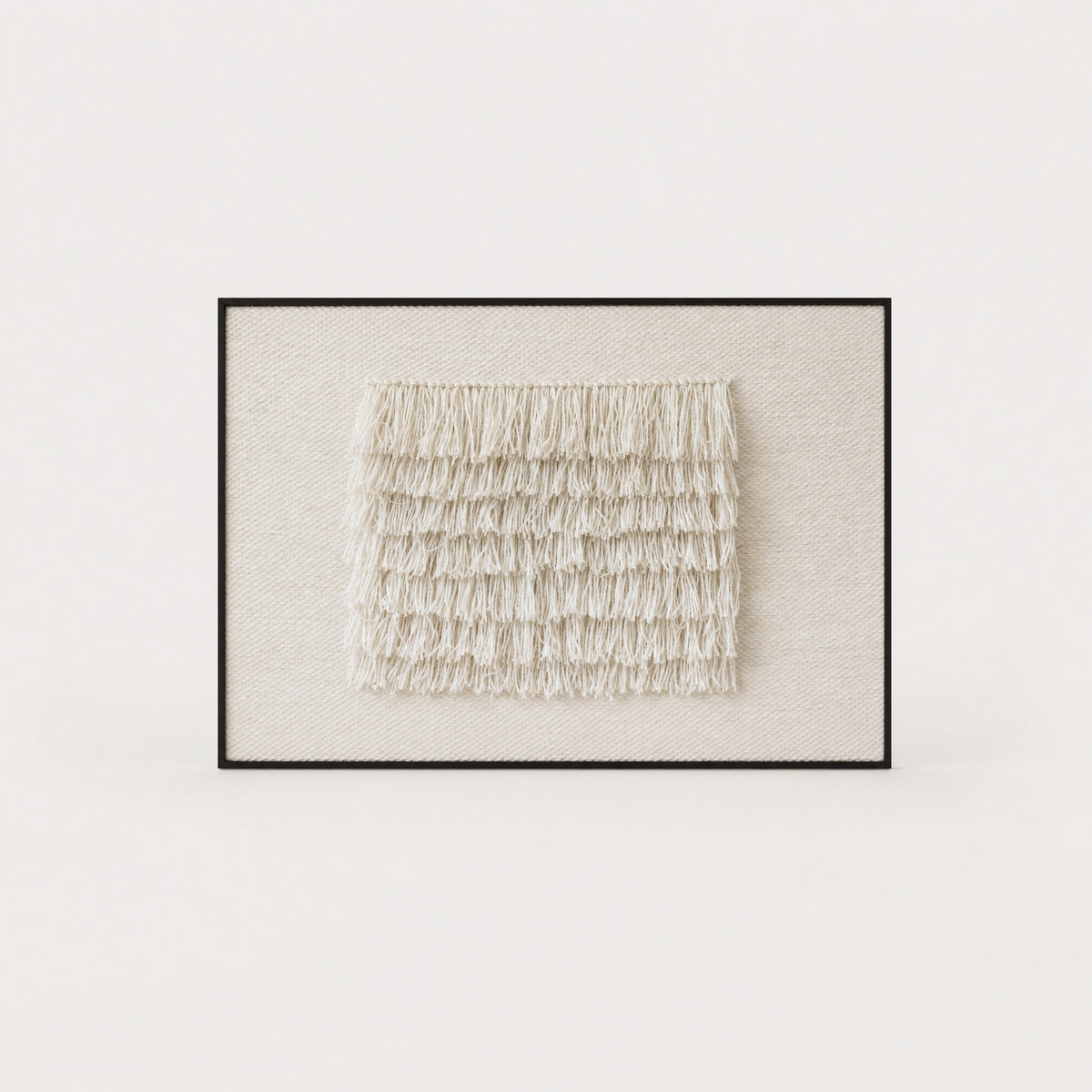 FruFru handwoven wool tapestry in raw white with rows of fluffy fringe on a cream ground in a slim dark walnut frame, framed textile wall art by Lale Studio & Shop