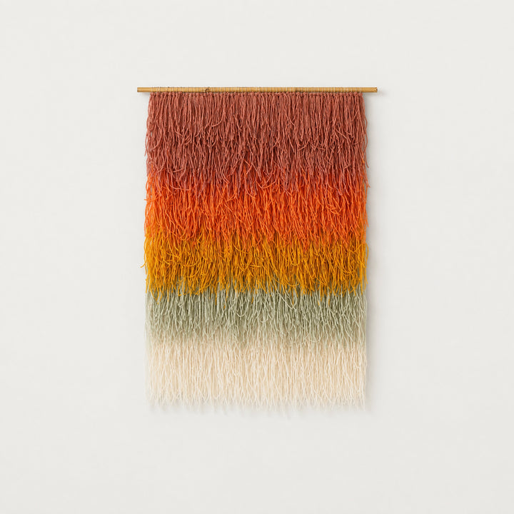 Gerbena handwoven multicolor ombre shaggy wool wall hanging on a bamboo rod, terracotta to sage gradient studio packshot — Lale Studio & Shop