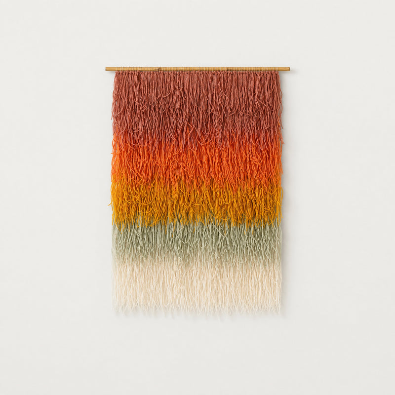 Gerbena handwoven multicolor ombre shaggy wool wall hanging on a bamboo rod, terracotta to sage gradient studio packshot — Lale Studio & Shop