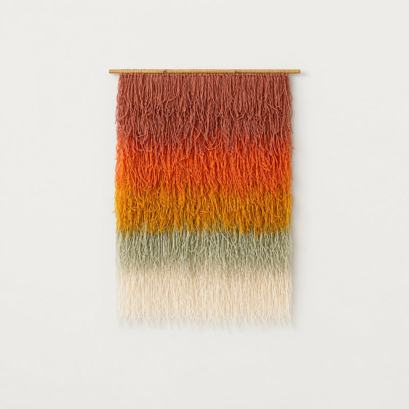 Gerbena handwoven multicolor ombre shaggy wool wall hanging on a bamboo rod, terracotta to sage gradient studio packshot — Lale Studio & Shop