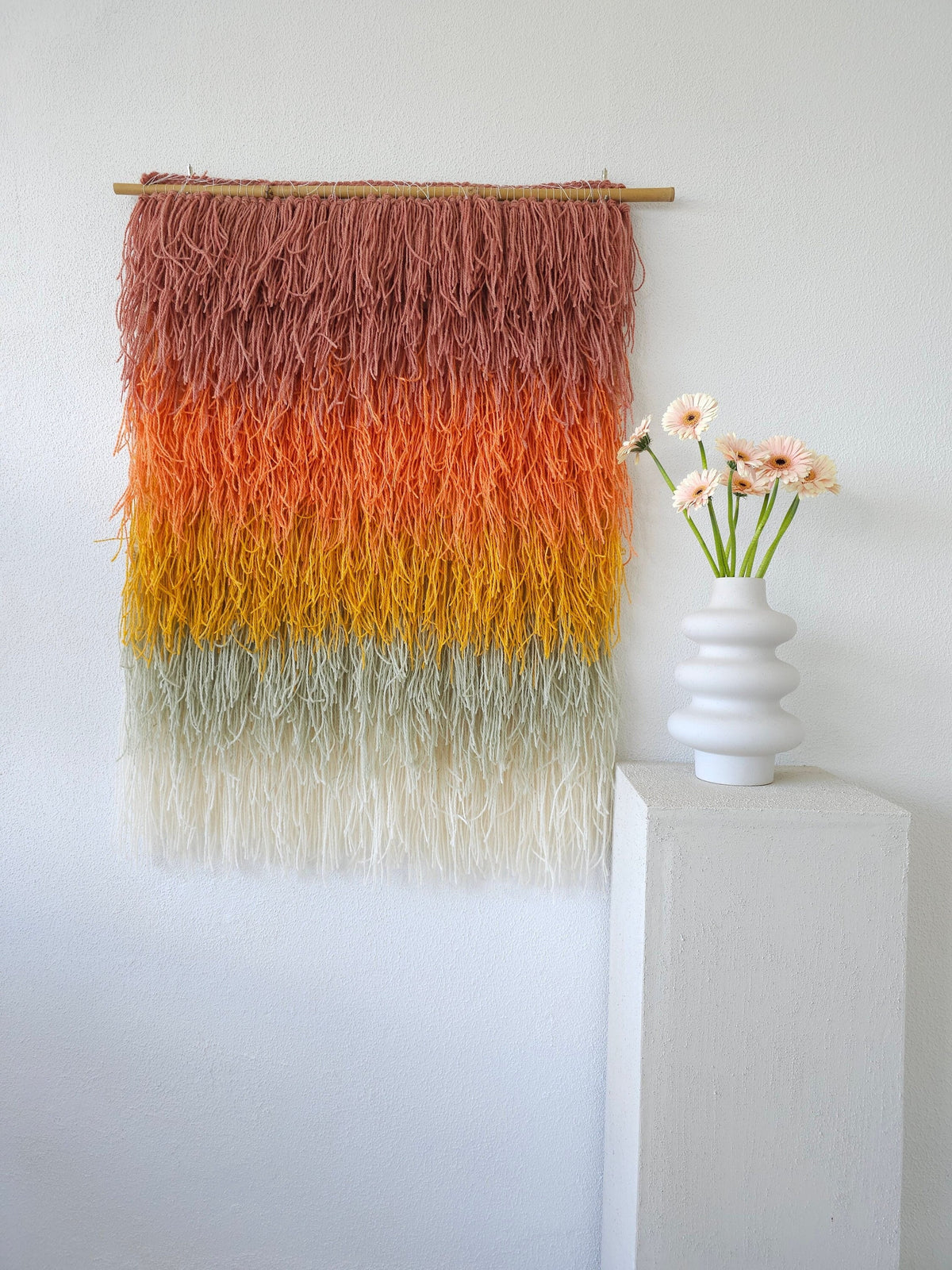 Close detail of Gerbena's shaggy two-ply wool fringe flowing from orange into gold — handwoven wall hanging by Lale Studio & Shop