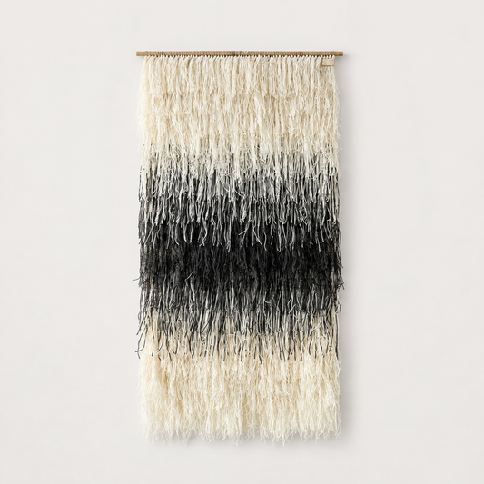 Gerhana shaggy handwoven wool wall hanging in natural cream and black on a bamboo rod, Lale Studio & Shop