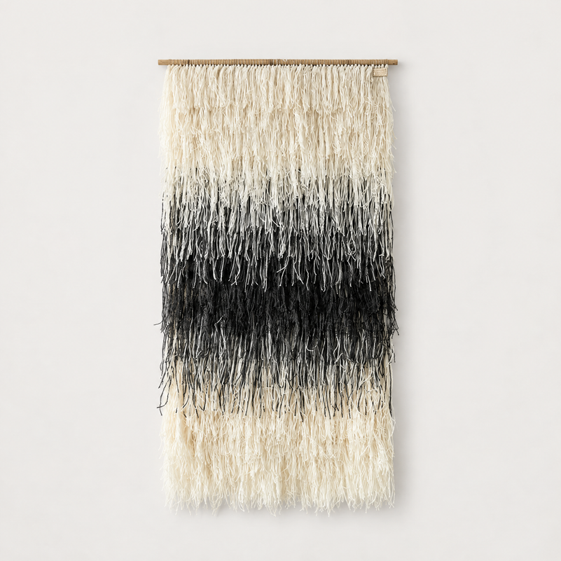 Gerhana shaggy handwoven wool wall hanging in natural cream and black on a bamboo rod, Lale Studio & Shop