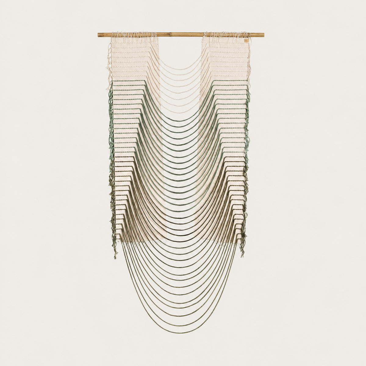 Green Urania handwoven cotton rope wall hanging with cascading semi circles in natural cream and soft green on a bamboo rod, Lale Studio & Shop