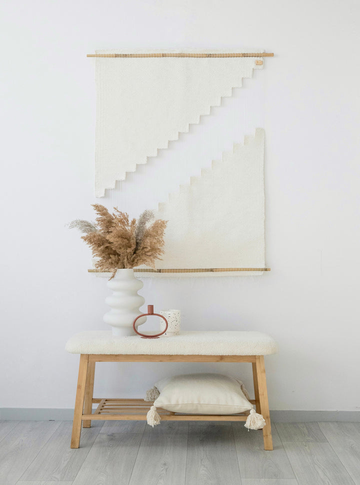 Hagdan handwoven natural cotton rope wall hanging with a bold geometric staircase pattern, hung between two bamboo rods — Lale Studio & Shop
