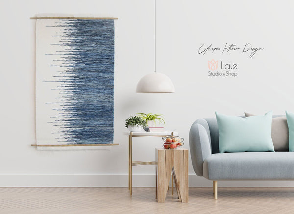 Cielo M handwoven wool tapestry shown hanging on a wall
