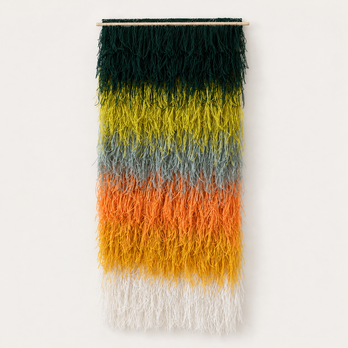 Calaia shaggy handwoven wool wall hanging in green, orange, yellow and cream ombre on a bamboo rod, Lale Studio & Shop