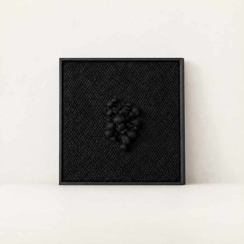 Enigma black sculptural handwoven two-ply wool tapestry in a slim black wood frame, Lale Studio & Shop