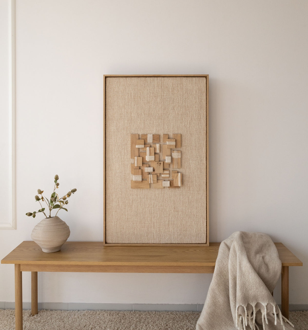 Inlay oak/pine wood-framed wool and oak wall hanging in a styled interior