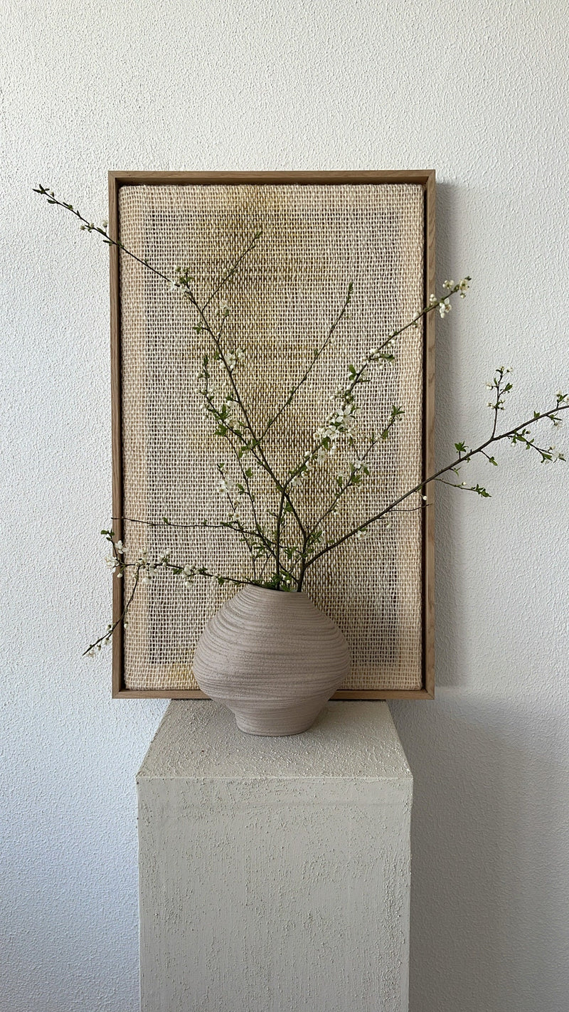 Detail of Millip's natural wool weave with grey and green tones