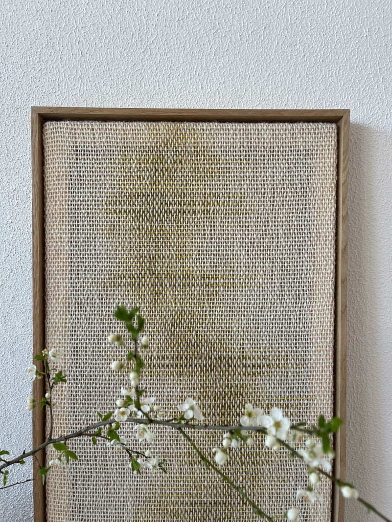 Millip framed woven art in a styled modern interior