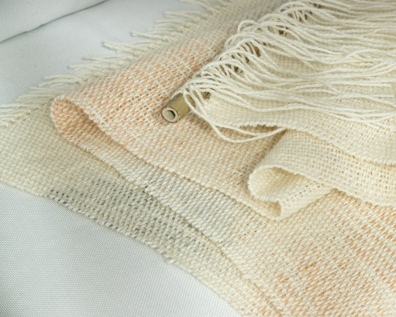 Detail of Misty Pearl's two-ply wool weave, cream and beige with rust tones