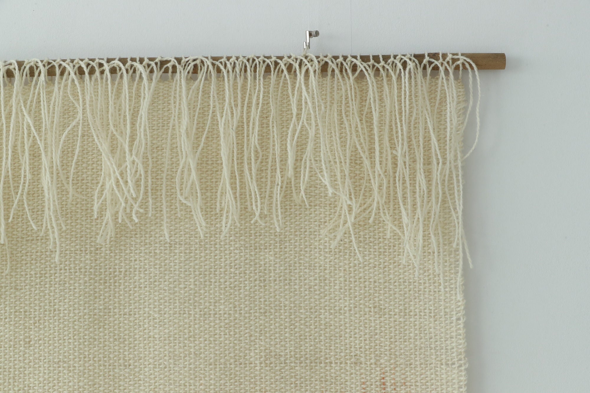Misty Pearl styled above a wooden sideboard in a calm bedroom
