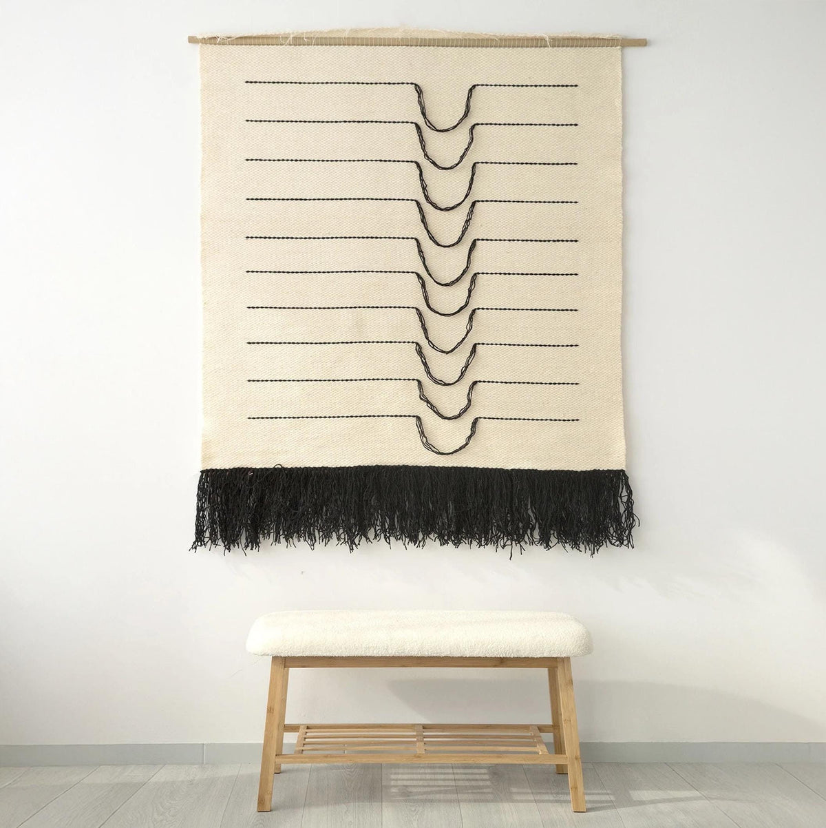 Naia large handwoven wool wall hanging with flowing black curved lines on natural wool, by Lale Studio & Shop