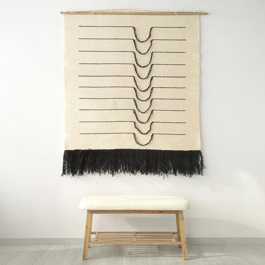 Naia large handwoven wool wall hanging with flowing black curved lines on natural wool, by Lale Studio & Shop