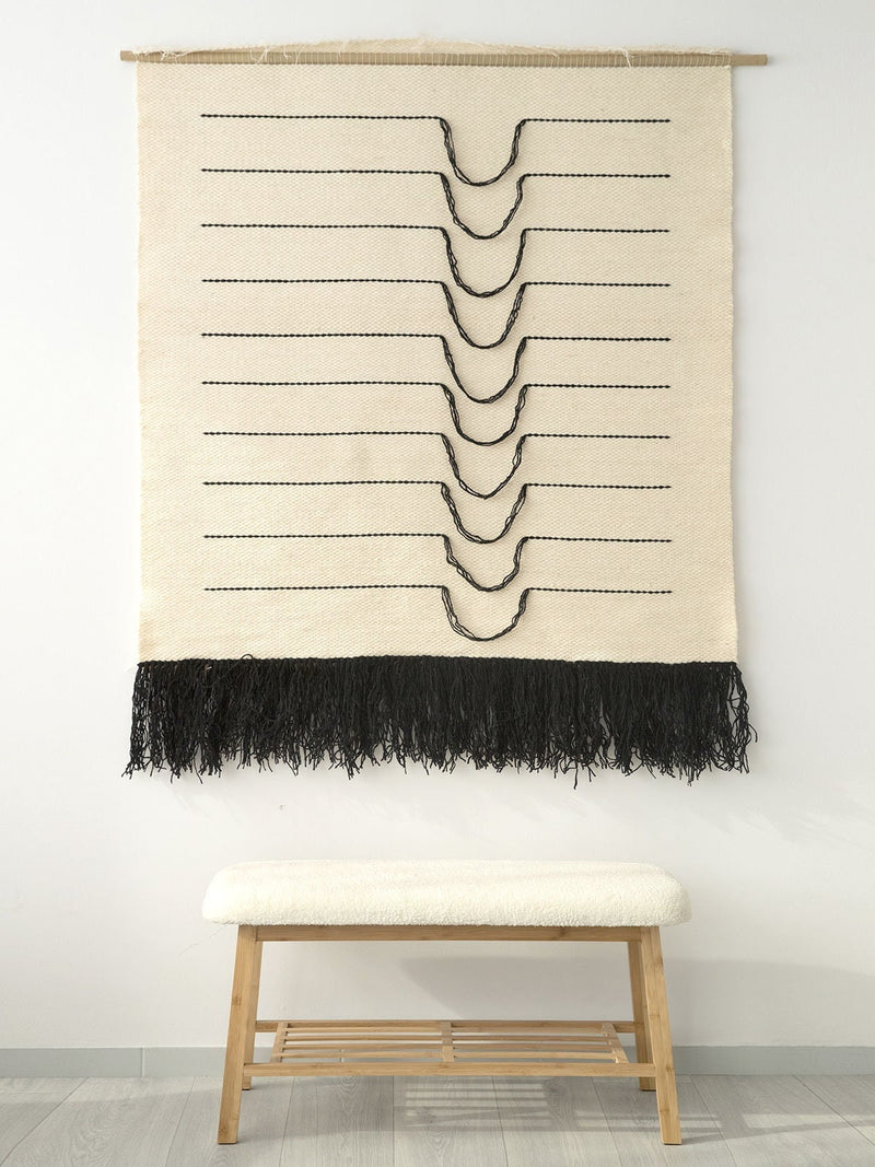 Detail of Naia's curved black lines and natural wool weave