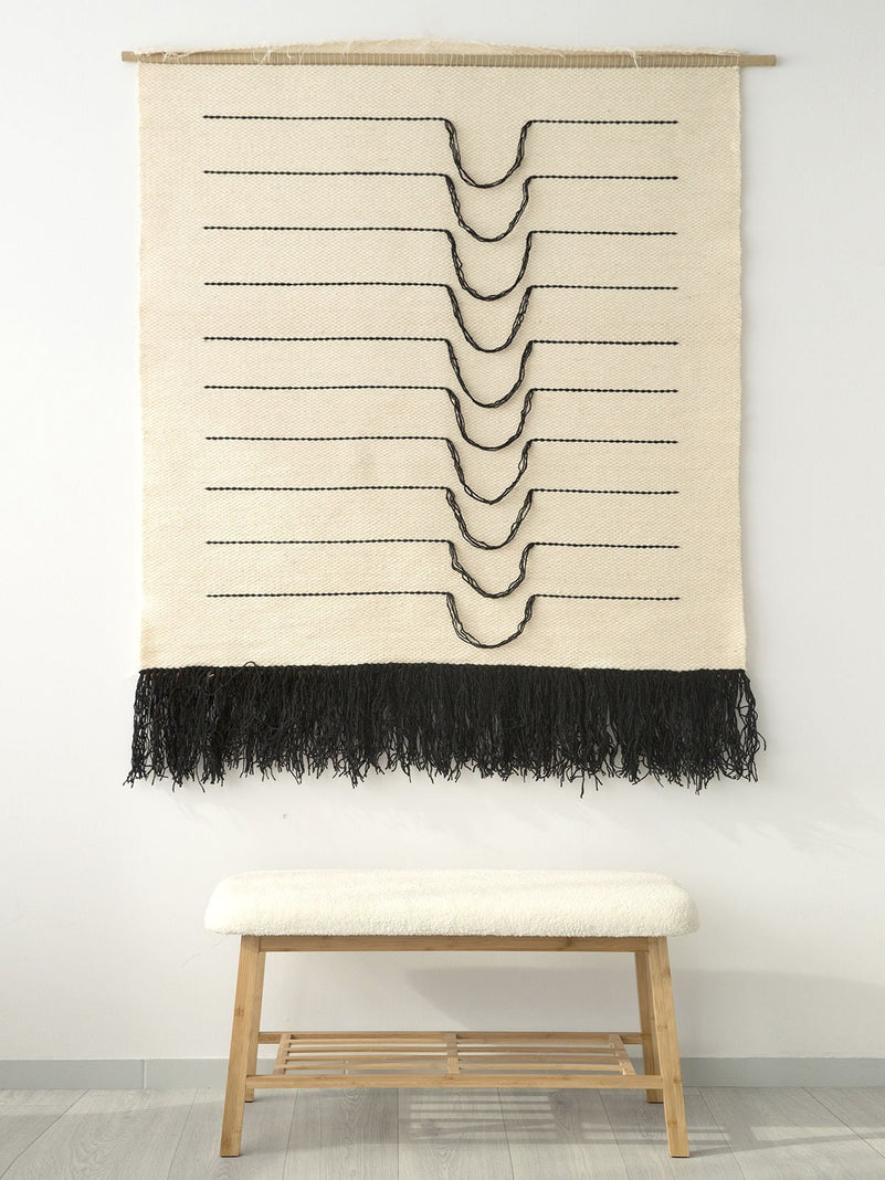 Detail of Naia's curved black lines and natural wool weave