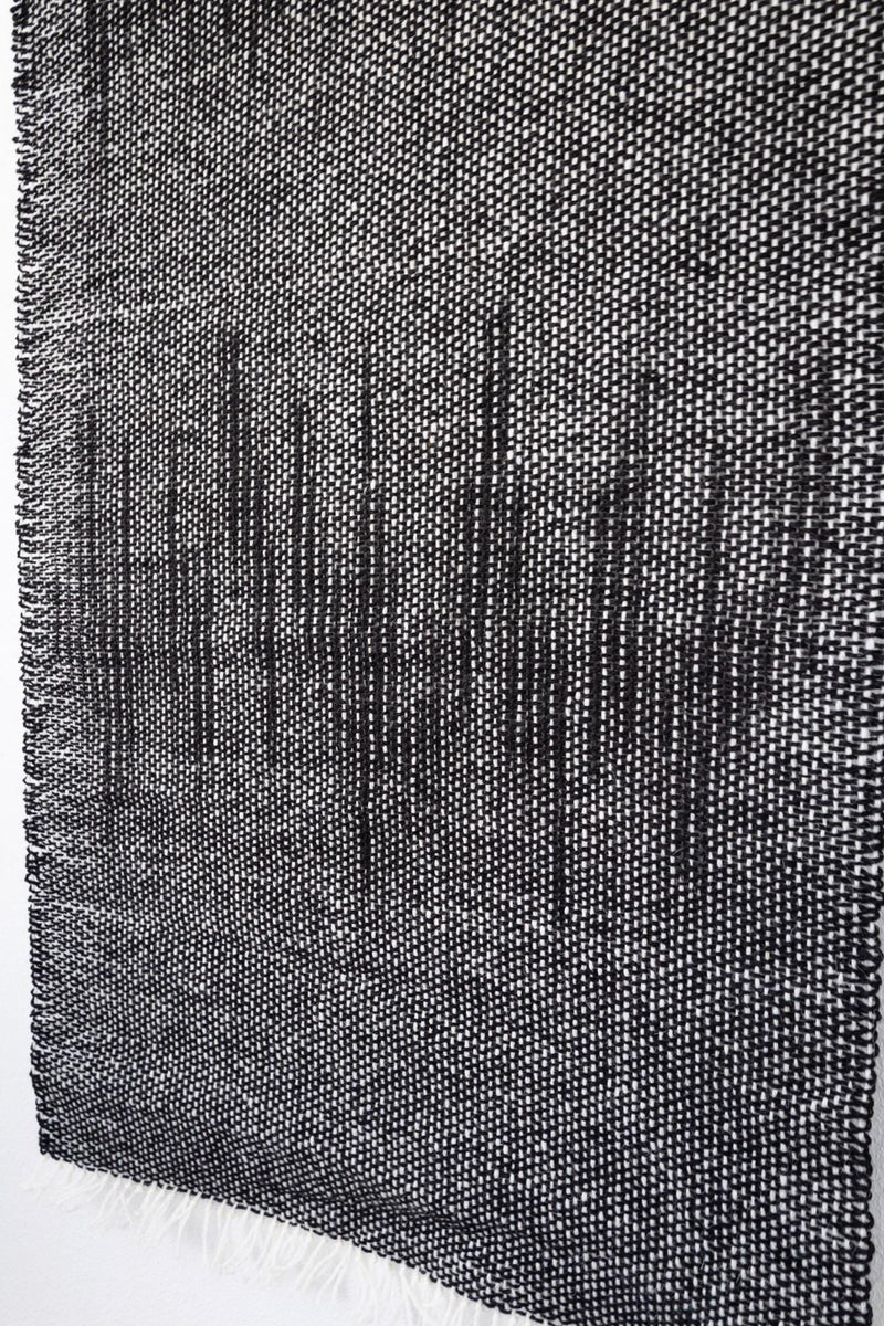 Detail of Nyora's dense two-ply wool weave and rain-like vertical pattern — handmade fiber art by Lale Studio & Shop