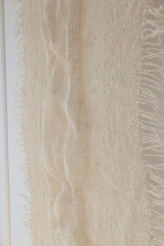 Perfecta handwoven wool tapestry shown hanging on a wall