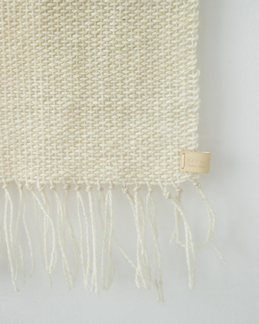 Serenity handwoven wool tapestry shown hanging on a wall