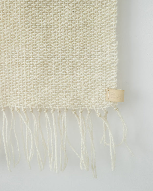 Serenity handwoven wool tapestry shown hanging on a wall