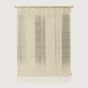 Surge handwoven wool wall hanging in natural beige with grey dip dye gradient and bottom fringe on a bamboo rod, Lale Studio & Shop