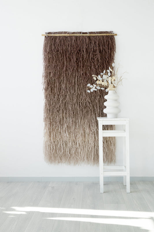 Tiramisu handwoven shaggy wool wall hanging with a bold circular motif in brown and beige, by Lale Studio & Shop