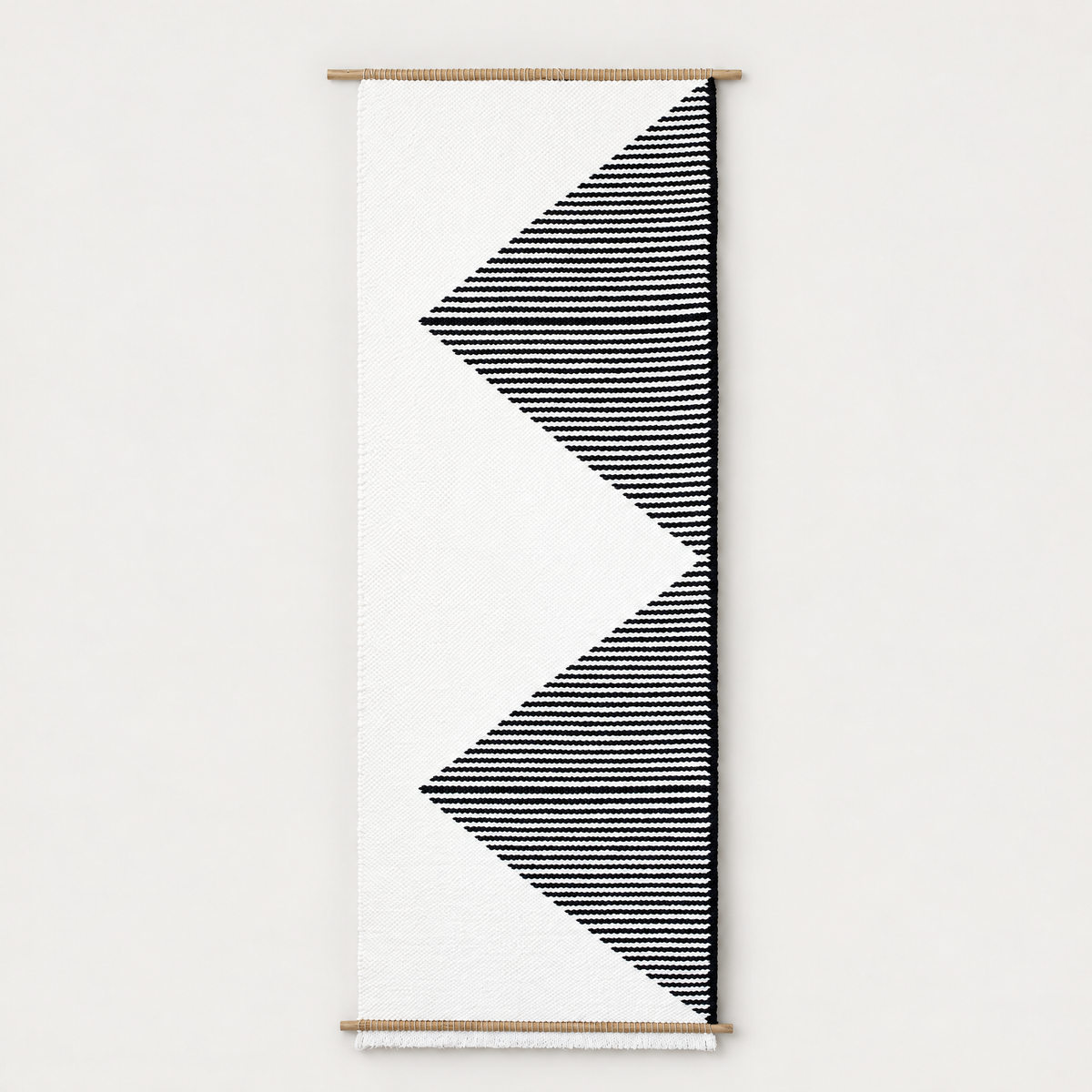 Trian handwoven wall hanging with black and white geometric triangles on bamboo rods, Lale Studio & Shop